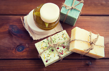 Image showing close up of handmade soap bars on wood