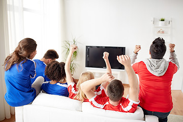 Image showing friends or football fans watching tv at home