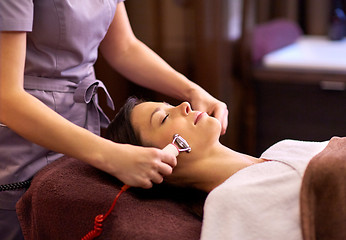 Image showing woman having hydradermie facial treatment in spa