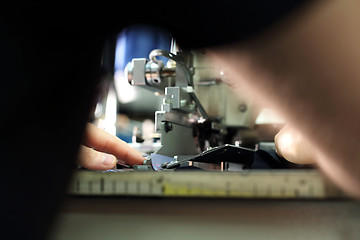 Image showing Production of clothes, sewing on a machine