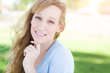 Image showing Outdoor Portrait of Young Adult Brown Eyed Woman.