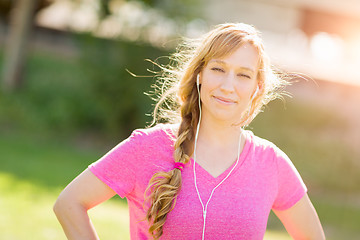 Image showing Young Fit Adult Woman Outdoors Workout Clothes Listening To Musi