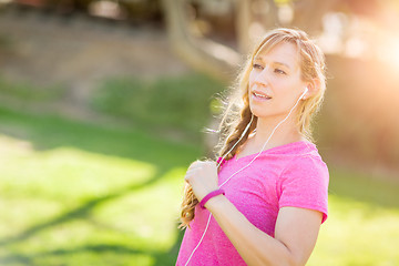 Image showing Young Fit Adult Woman Outdoors During Workout Listening To Music