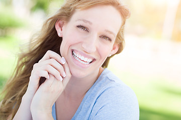 Image showing Outdoor Portrait of Young Adult Brown Eyed Woman.