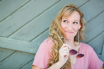 Image showing Outdoor Portrait of Young Adult Brown Eyed Woman With Sunglasses
