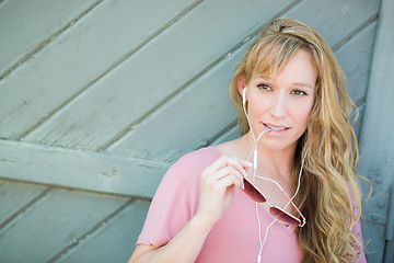 Image showing Outdoor Portrait of Young Adult Brown Eyed Woman With Sunglasses