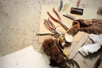 Image showing Natural fur tailor made workshop furrier. A tailor, leather craft