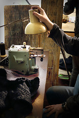 Image showing Sewing machine. Sewing machine in a tailor shop. 