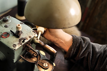 Image showing Maintenance of the sewing machine.