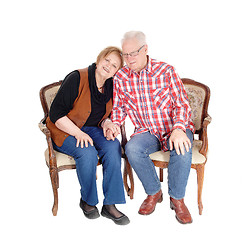 Image showing Lovely senior couple in armchair.