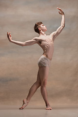 Image showing The male ballet dancer posing over gray background