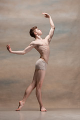 Image showing The male ballet dancer posing over gray background