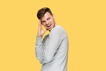 Image showing The young man smiling and looking away