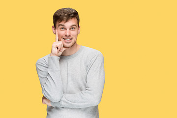 Image showing The young man smiling and looking at camera