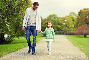 Image showing happy family walking in summer park