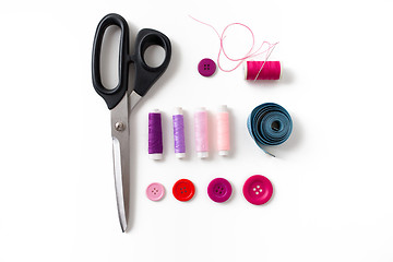 Image showing scissors, sewing buttons, threads and tape measure