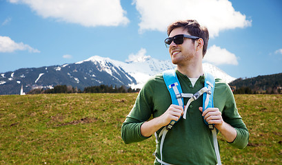 Image showing happy young man with backpack traveling