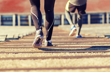 Image showing close up of couple running downstairs on stadium