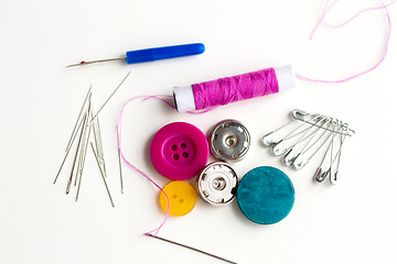 Image showing sewing buttons, needles, pins and thread spool