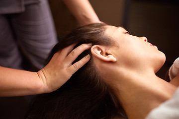 Image showing woman having head massage at spa