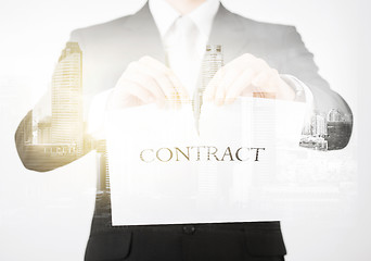 Image showing close up of businessman holding contract paper