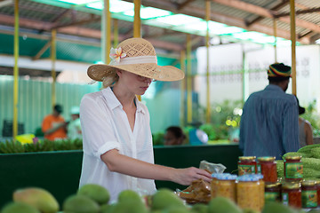 Image showing Traveler shopping on traditional Victoria food market, Seychelles.