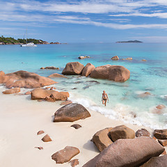 Image showing Woman enjoying Anse Lazio picture perfect beach on Praslin Island, Seychelles.