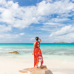 Image showing Woman enjoying Anse Patates picture perfect beach on La Digue Island, Seychelles.