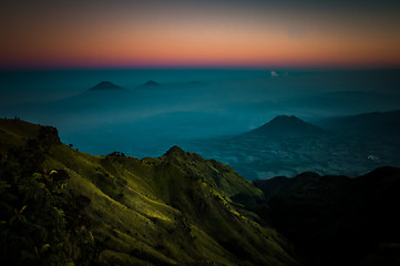 Image showing Stratovolcano and mountains in morning fog