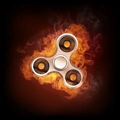 Image showing Fidget spinner in fire isolated on black background banner.