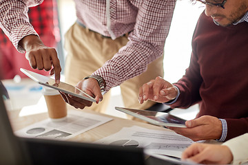 Image showing businessmen with tablet pc and charts at office