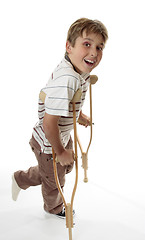 Image showing Smiling boy on crutches