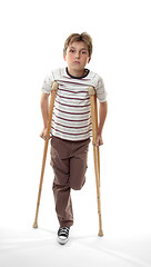 Image showing injured boy on crutches