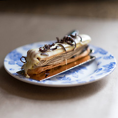 Image showing  Chocolate eclair with glaze. selective focus