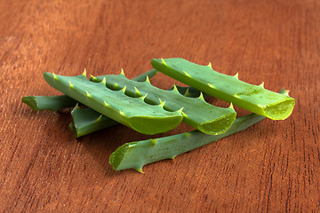 Image showing aloe vera fresh leaf on wooden table