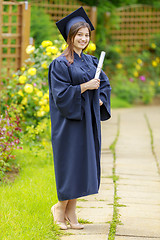 Image showing Graduated young woman smiling at camera