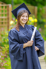 Image showing Graduated young woman smiling at camera