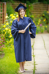 Image showing Graduated young woman smiling at camera