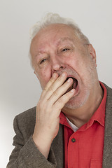 Image showing Bearded man yawning