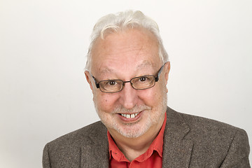 Image showing Elderly person with glasses and full beard smiling pleased