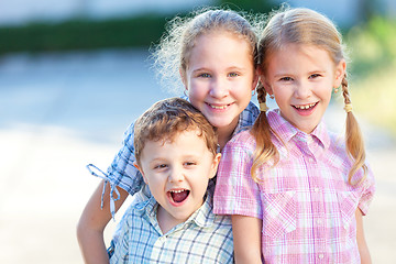 Image showing Portrait of happy children near a house 