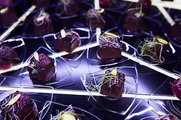 Image showing Beautifully decorated catering banquet table with different food snacks.