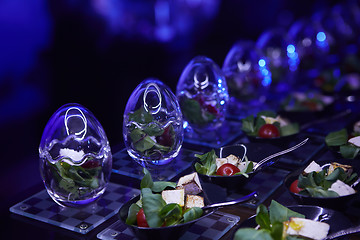 Image showing Beautifully decorated catering banquet table with different food snacks.