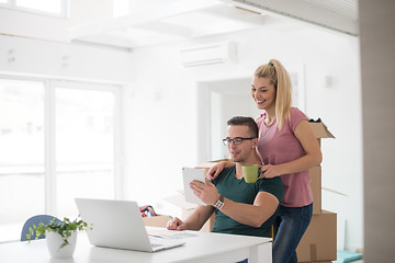 Image showing Young couple moving in a new home