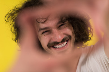 Image showing young man with funny hair over color background