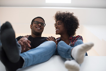 Image showing couple having break during moving to new house