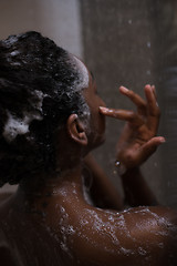 Image showing African American woman in the shower