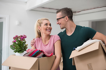 Image showing young couple moving into a new home