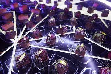 Image showing Beautifully decorated catering banquet table with different food snacks.