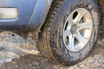 Image showing Car tires dirt road in winter snow and ice